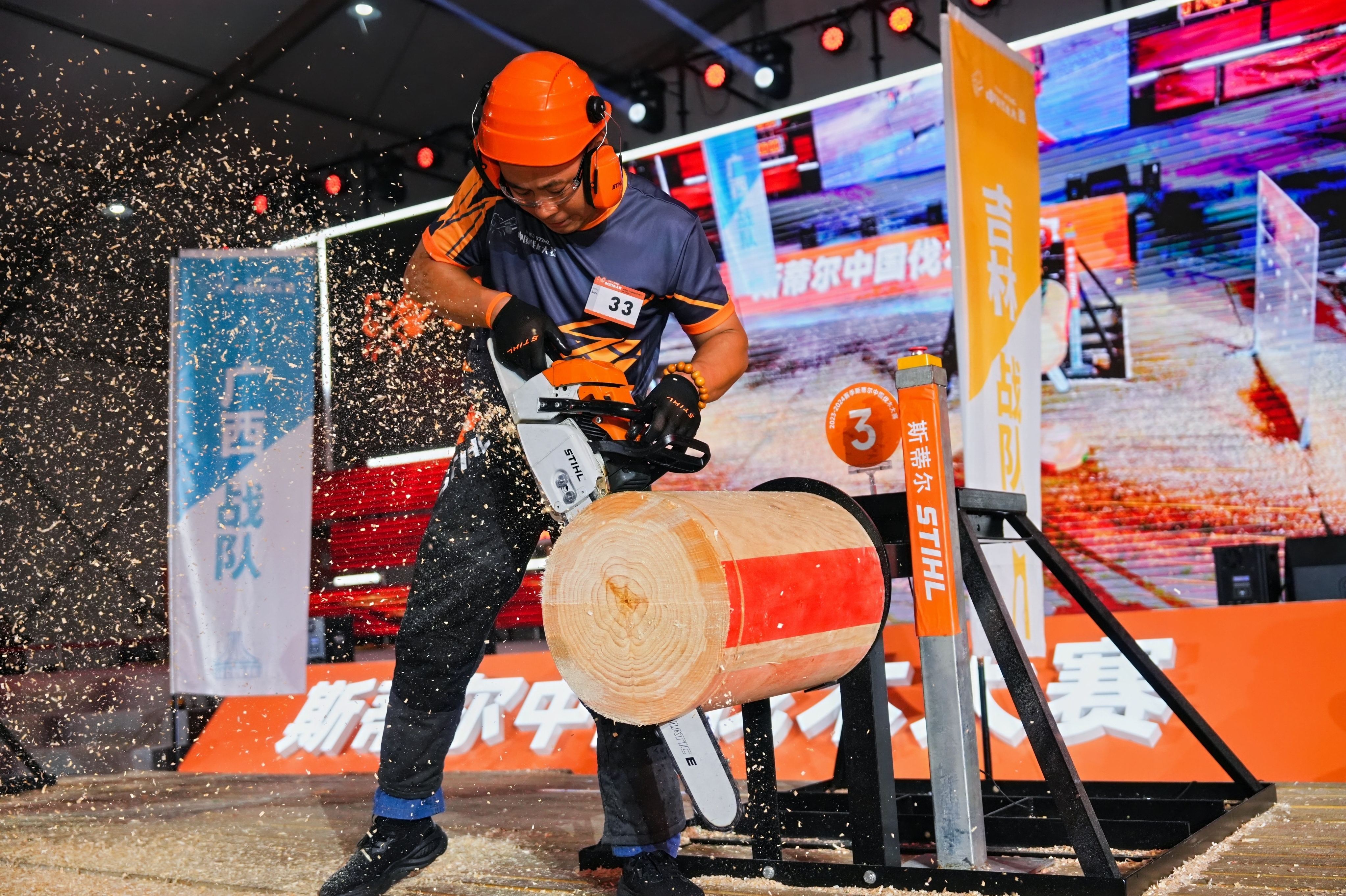 Man with chainsaw at timbersports event